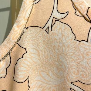 Light pink sleeveless blouse. Great for workwear!